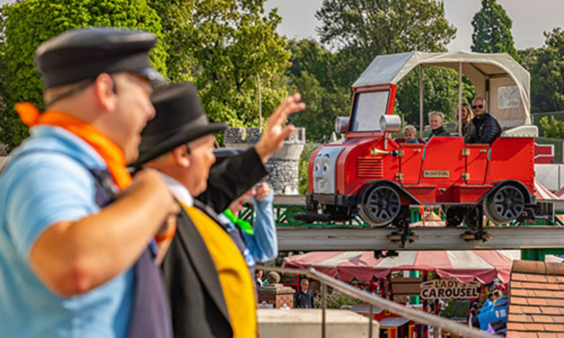 Sir Topham Hat waving to guests on Winstons